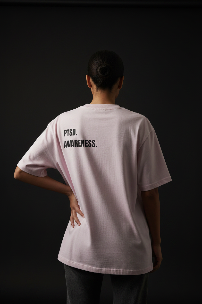 Model with dark lighting and pose - PTSD Awareness tee back view